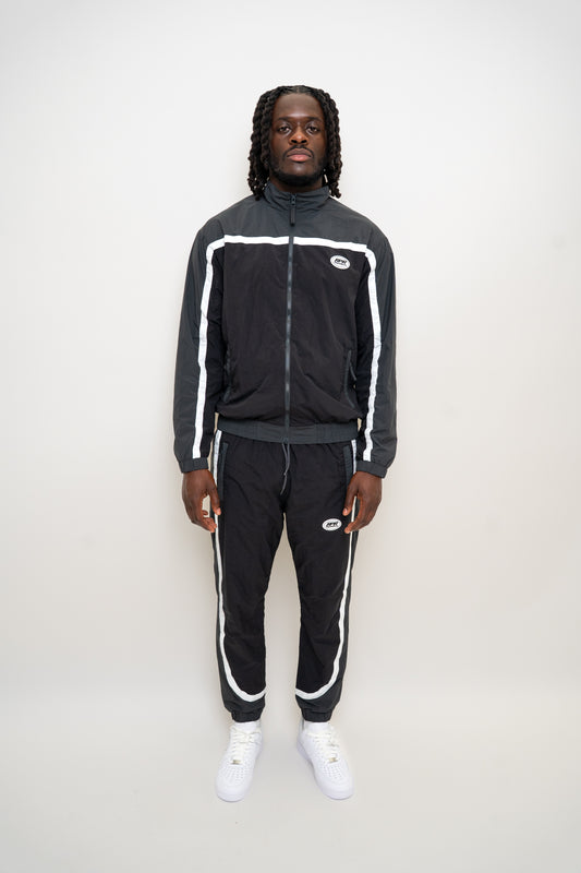 black nylon tracksuit
charcoal grey tracksuit set
RPR DopeBoy tracksuit
full zip athletic set
unisex streetwear tracksuit
mesh lined jacket and pants
relaxed fit activewear
tapered jogger set
men’s black tracksuit
lightweight nylon two-piece