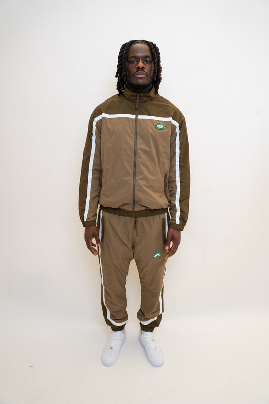 khaki tracksuit
brown nylon tracksuit
RPR DopeBoy set
military green tracksuit
unisex two-piece activewear
full zip tracksuit with logo
lightweight streetwear set
mesh-lined tracksuit
nylon jacket and pants set
urban utility style tracksuit