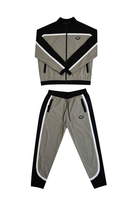 Black and grey windbreaker tracksuit set with matching jacket and pants and white contrast stripes