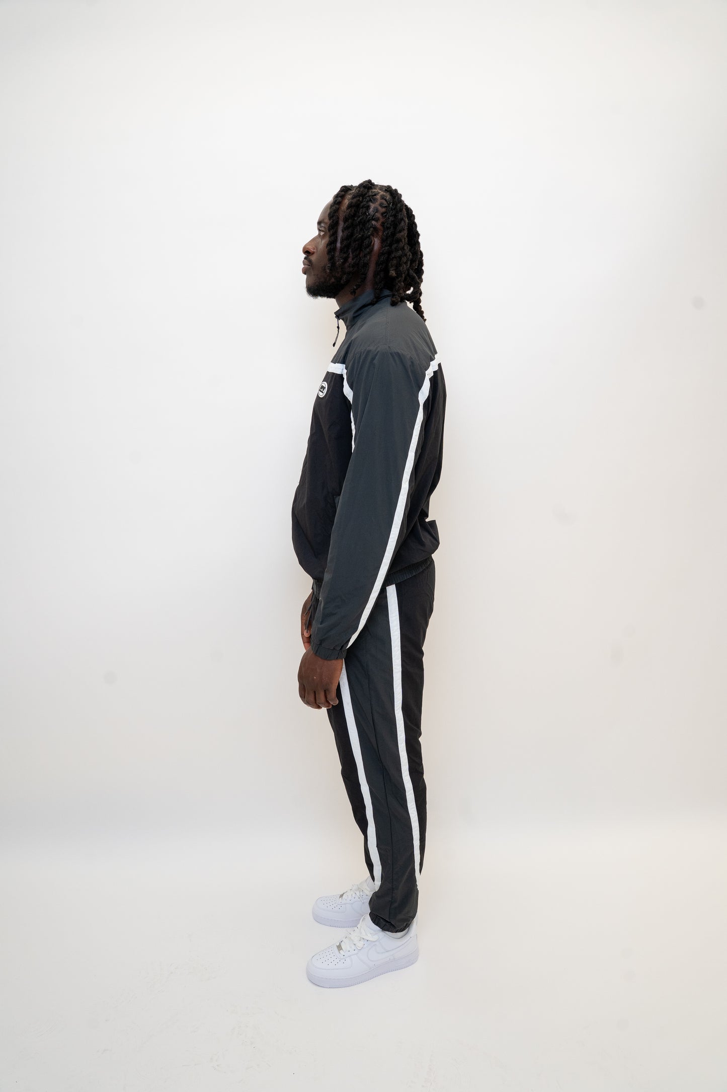black nylon tracksuit

charcoal grey tracksuit set

RPR DopeBoy tracksuit

full zip athletic set

unisex streetwear tracksuit

mesh lined jacket and pants

relaxed fit activewear

tapered jogger set

men’s black tracksuit

lightweight nylon two-piece