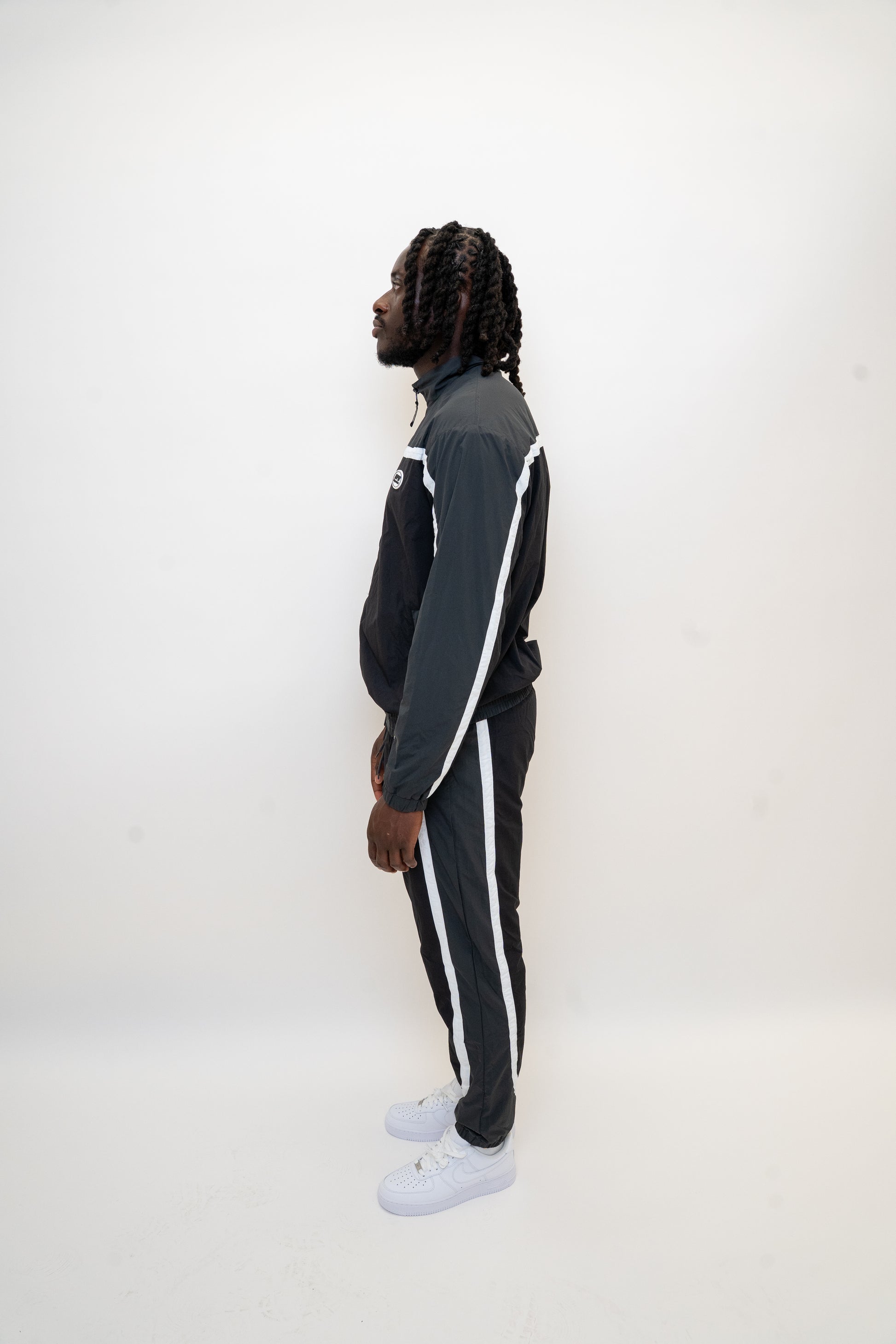 black nylon tracksuit

charcoal grey tracksuit set

RPR DopeBoy tracksuit

full zip athletic set

unisex streetwear tracksuit

mesh lined jacket and pants

relaxed fit activewear

tapered jogger set

men’s black tracksuit

lightweight nylon two-piece