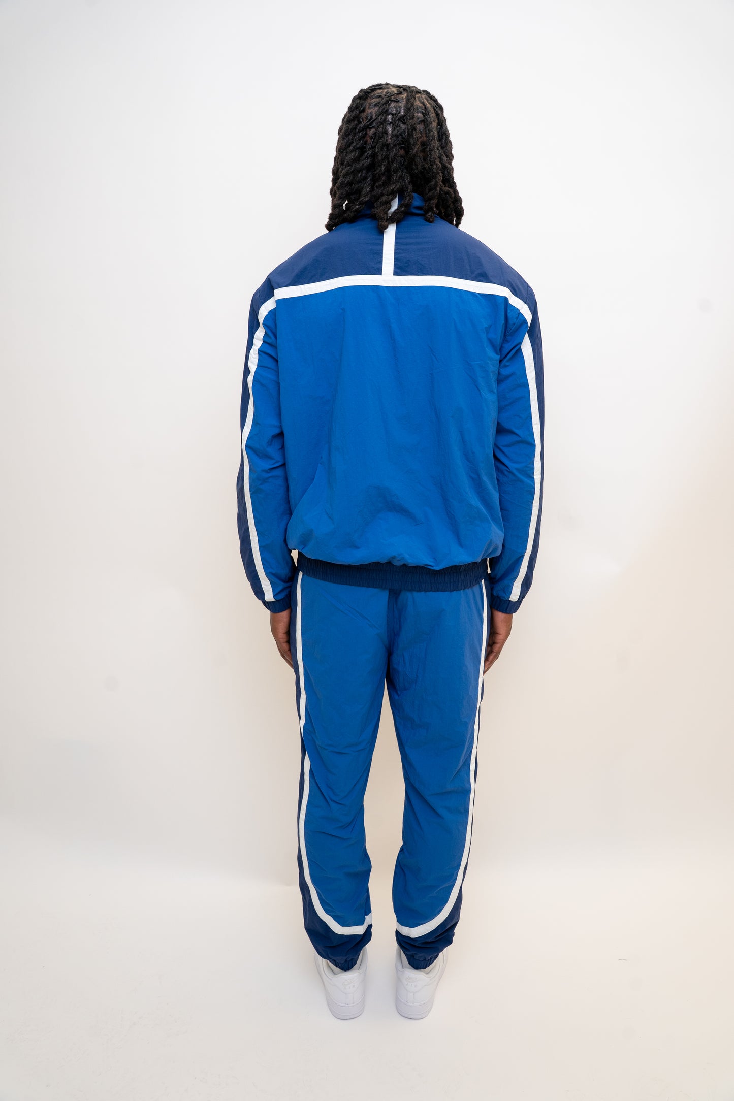 ocean blue tracksuit

navy nylon tracksuit

men’s full tracksuit set

unisex drawstring tracksuit

mesh lined activewear

zip-up track jacket and pants

relaxed fit tracksuit

DopeBoy tracksuit

streetwear active set

lightweight sports tracksuit