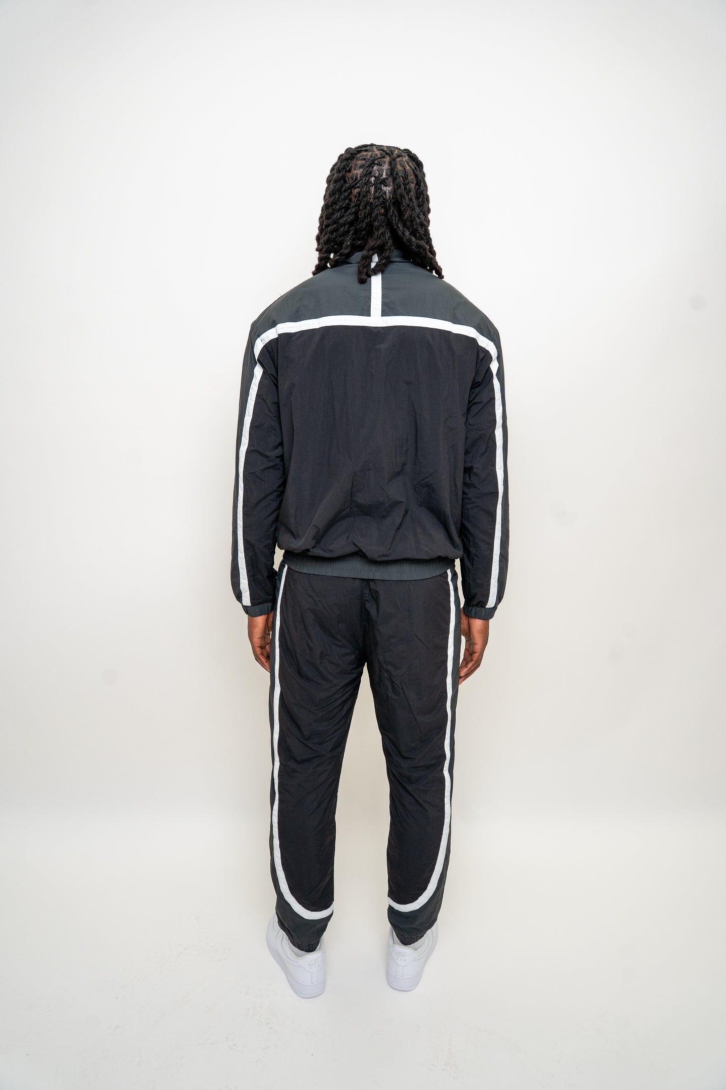black nylon tracksuit

charcoal grey tracksuit set

RPR DopeBoy tracksuit

full zip athletic set

unisex streetwear tracksuit

mesh lined jacket and pants

relaxed fit activewear

tapered jogger set

men’s black tracksuit

lightweight nylon two-piece
