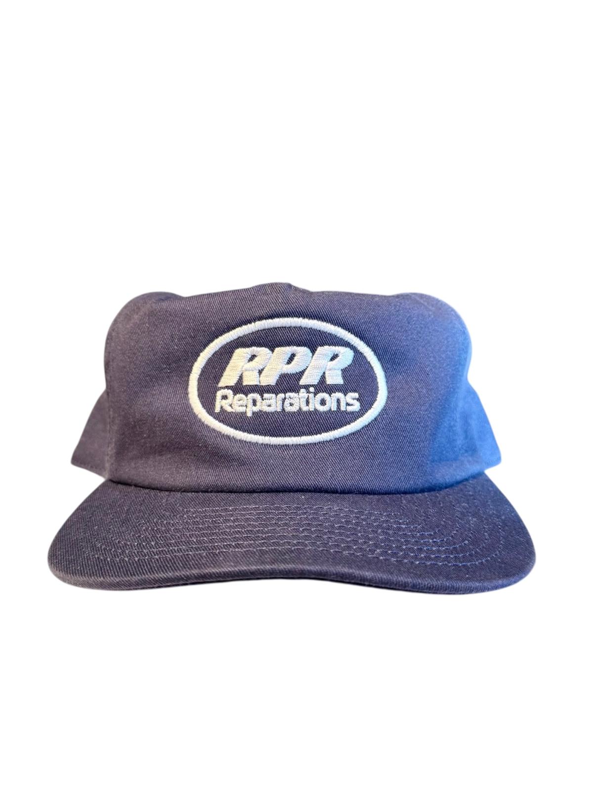 Blue cap with 'RPR Reparations' logo on a white background